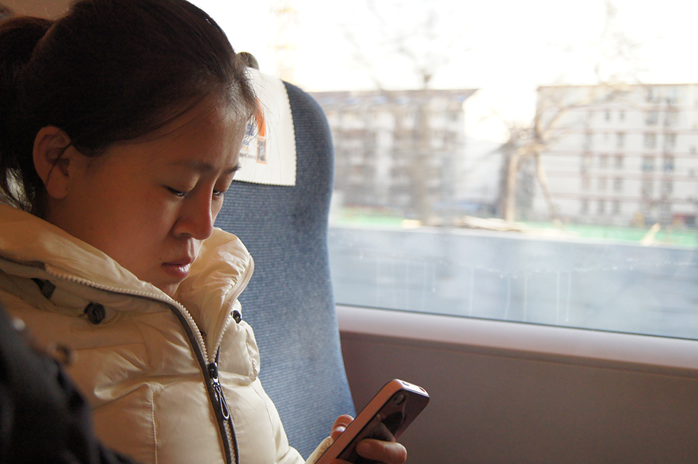 Lu Tianyi on a train (Photo: Allison Griner) - ONLINE--lu-train