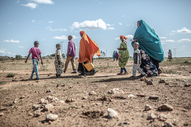 refugees walking